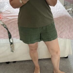 Client in her standard baggy shorts