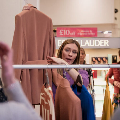 Toni with rail of clothes